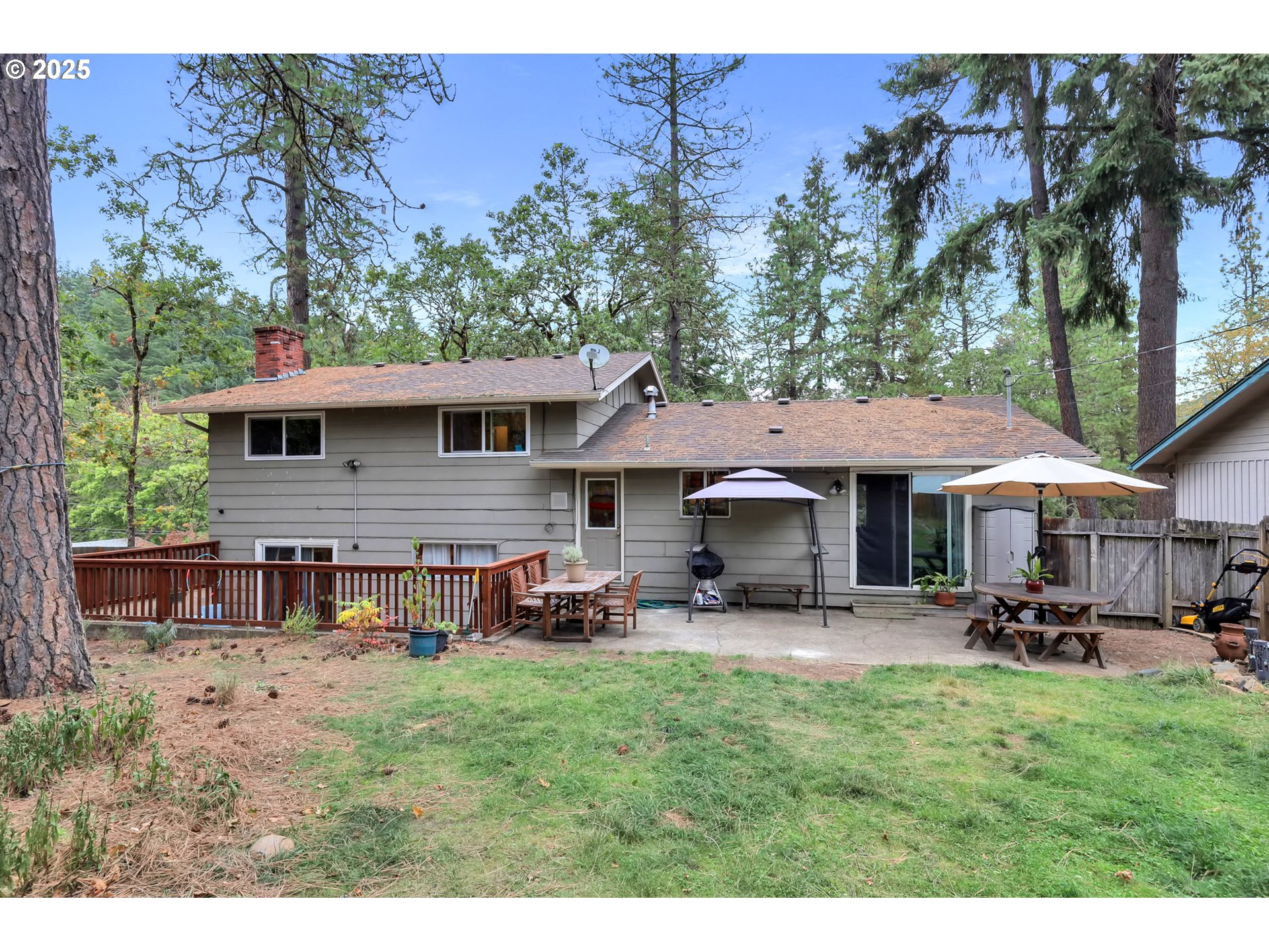 910 East 43rd Avenue Eugene, OR 97405 - Photo 42 of 47 a view of a house with a yard and sitting area