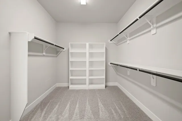 a view of an empty walk in closet