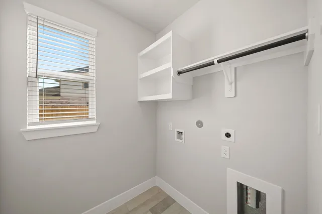 a small space with a window and a shower