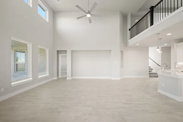 an empty room with windows and entrance