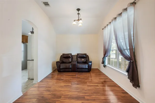 a living room with a couch and a rug