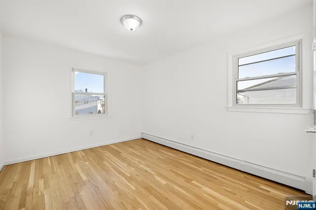 an empty room with a empty space and window