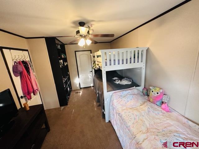 62880 Lasalle Road, Unit 185 Montrose, CO 81401 - Photo 12 of 19 a bedroom with a bed and wooden floor