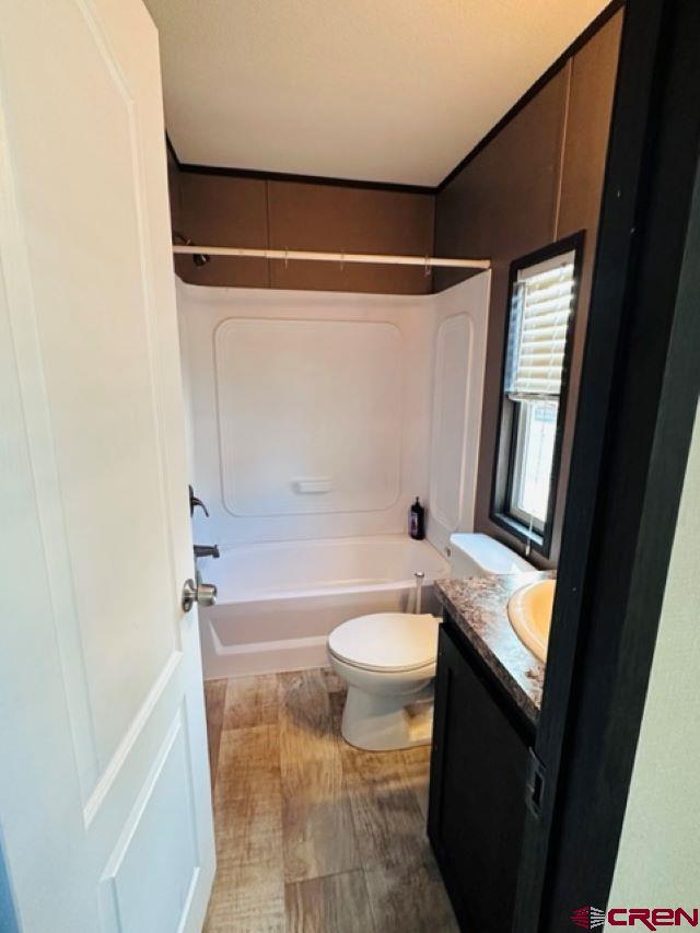 62880 Lasalle Road, Unit 185 Montrose, CO 81401 - Photo 14 of 19 a bathroom with a sink toilet and shower