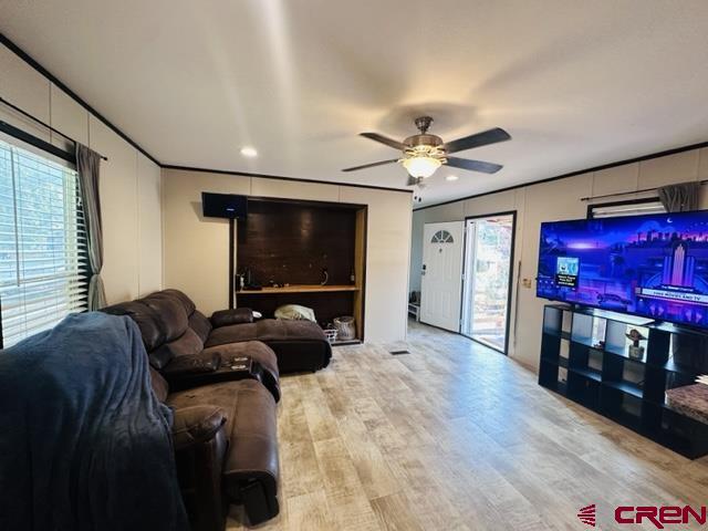 62880 Lasalle Road, Unit 185 Montrose, CO 81401 - Photo 2 of 19 a living room with furniture and a flat screen tv