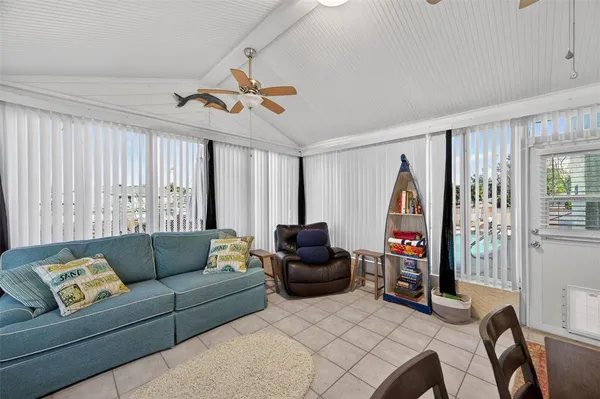 a view of a livingroom with furniture and a flat screen tv