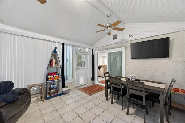 a dining room with furniture and window