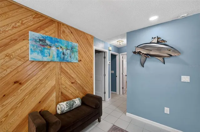 a bedroom with furniture and a flat screen tv