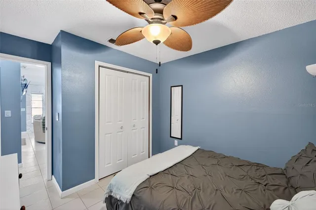 a view of a chandelier fan and closet