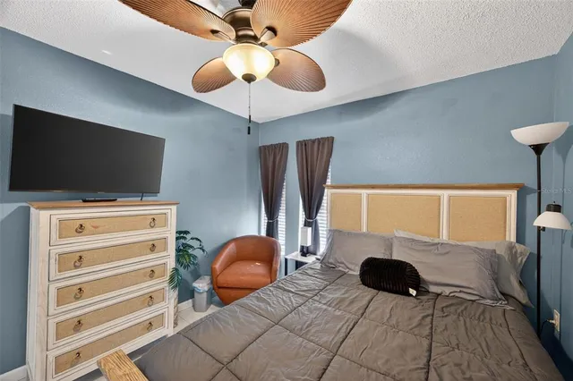 a swimming pool with outdoor seating and yard