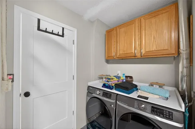 a swimming pool with outdoor seating yard and barbeque oven