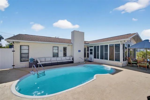 a view of a balcony with two chairs and a table