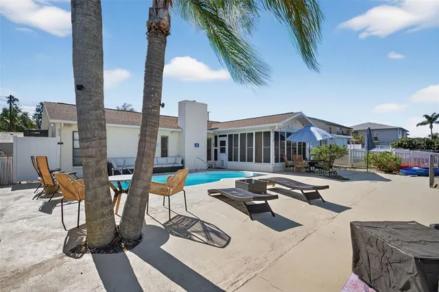a view of a roof deck with couches and wooden floor