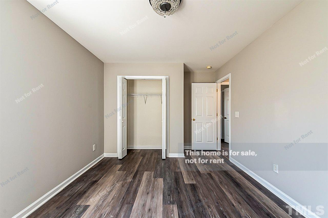 5304 Neuse Forest Road Raleigh, NC 27616 - Photo 21 of 26 a view of room with window and wooden floor