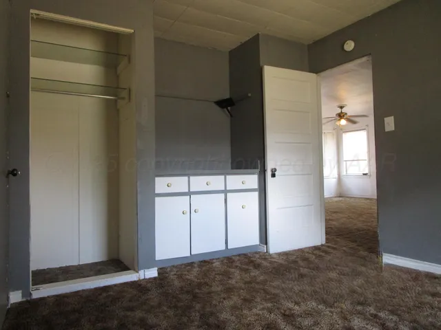 a white toilet sitting next to a bath tub