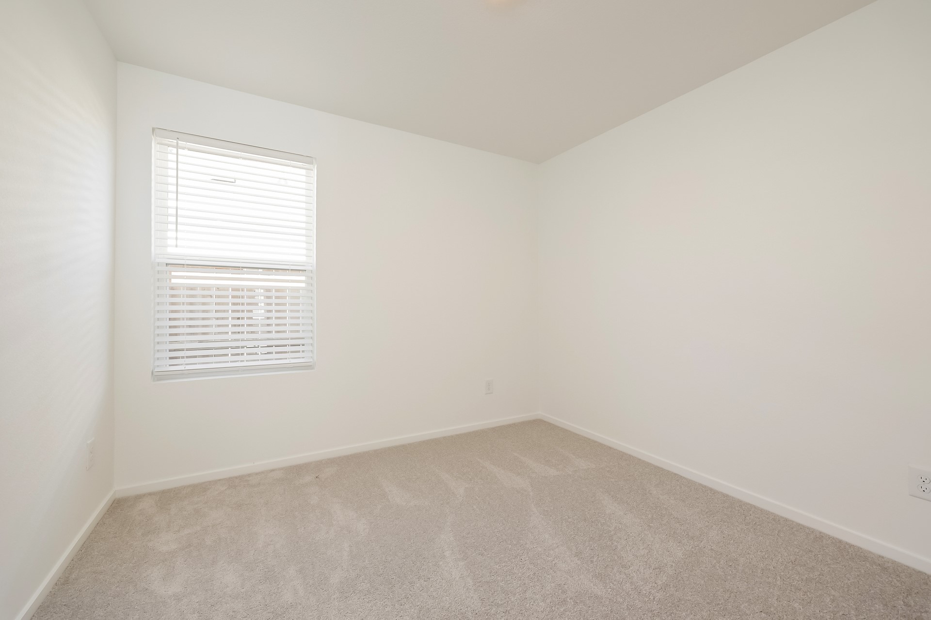 18064 Trepito Avenue New Caney, TX 77357 - Photo 12 of 15 an empty room with a window