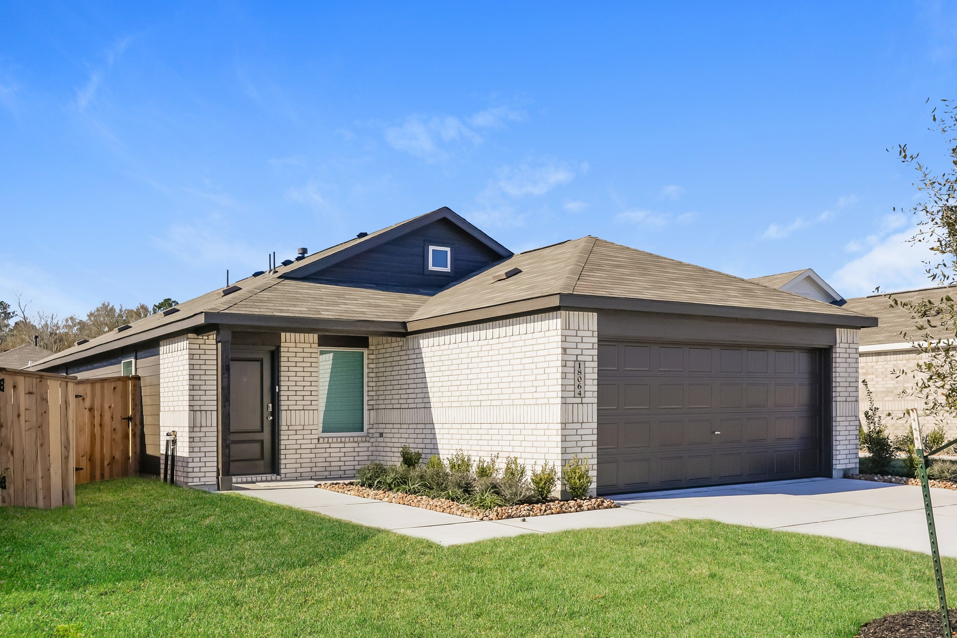 18064 Trepito Avenue New Caney, TX 77357 - Photo 2 of 15 a front view of house with yard