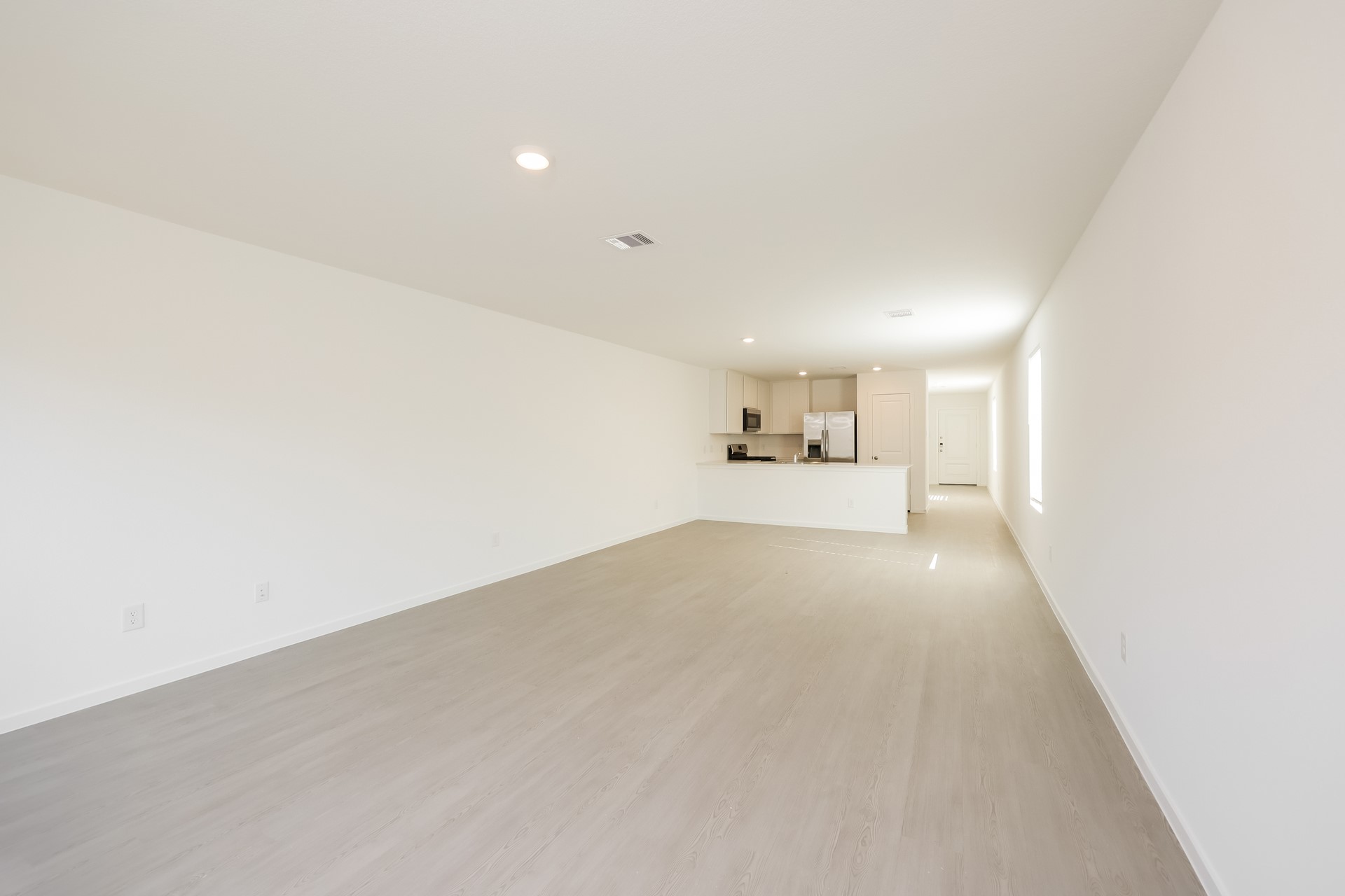 18064 Trepito Avenue New Caney, TX 77357 - Photo 7 of 15 a view of empty room with kitchen