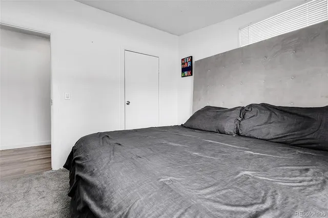 a bedroom with a bed and a cabinets