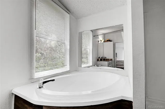 a bathroom with a bathtub and a sink