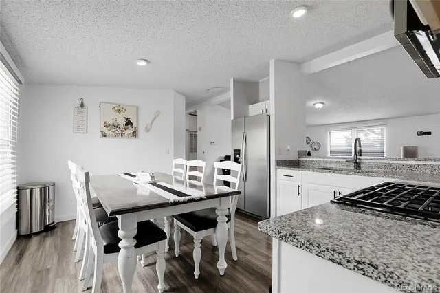 a kitchen with a table and chairs in it