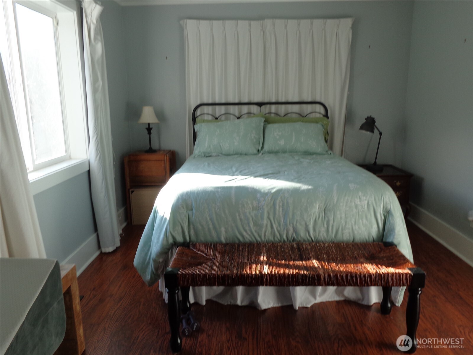 1639 22nd Avenue Longview, WA 98632 - Photo 17 of 35 a bedroom with a bed and wooden floor