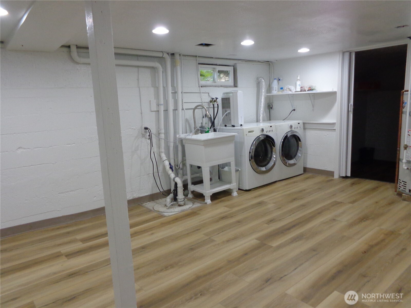 1639 22nd Avenue Longview, WA 98632 - Photo 26 of 35 a view of a storage & utility room with washer and dryer