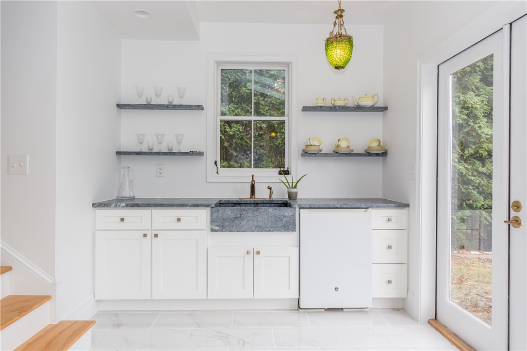 443 Bellevue Avenue Newport, RI 02840 - Photo 25 of 49 Pool House wet bar w/ Soapstone sink + counter tops plus mini refrigerator.