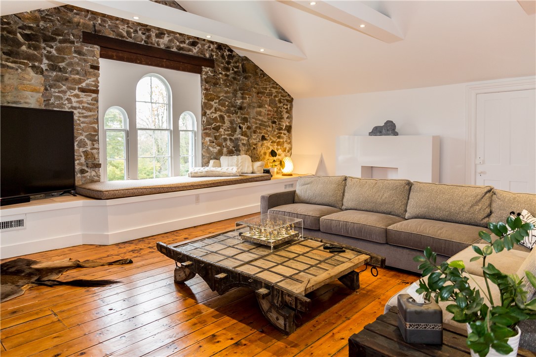 443 Bellevue Avenue Newport, RI 02840 - Photo 40 of 49 Recreational room with sectional couch, TV, desk space, yoga/exercise/mediation area.