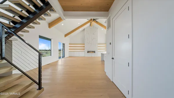 a view of empty room with stairs