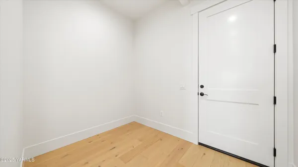 a view of a small space with wooden floor