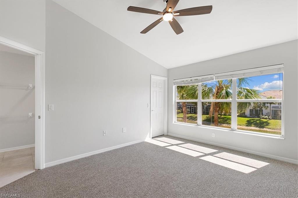 839 Hampton Circle, Unit 149 Naples, FL 34105 - Photo 11 of 22 a view of an empty room with a window
