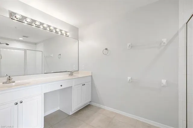 a bathroom with a double vanity sink mirror and double