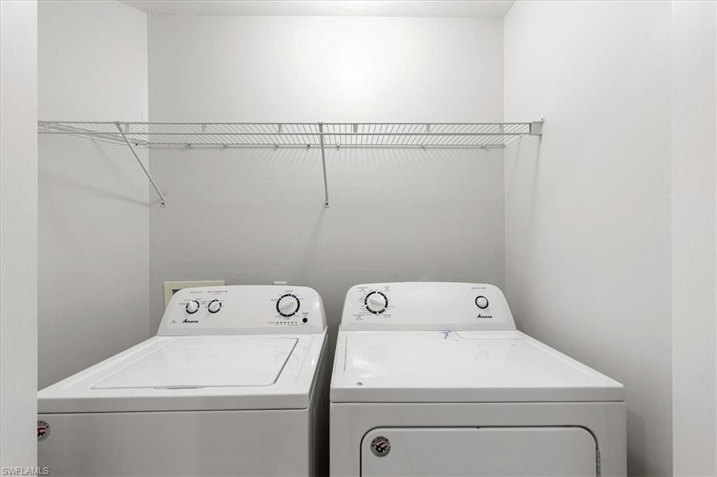 839 Hampton Circle, Unit 149 Naples, FL 34105 - Photo 19 of 22 a utility room with dryer and washer