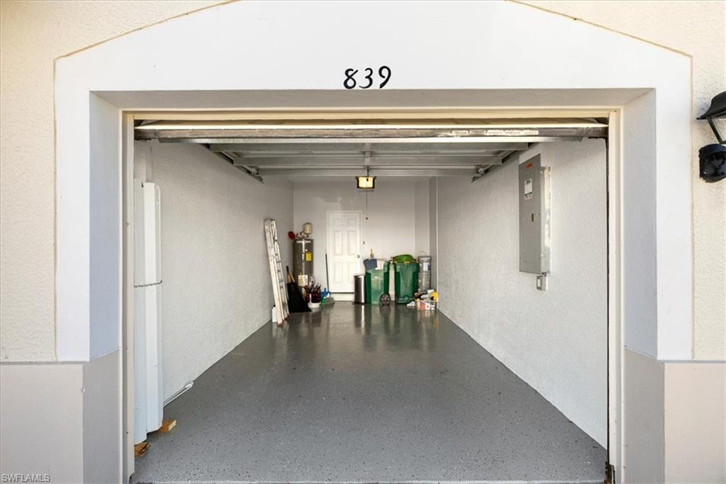 839 Hampton Circle, Unit 149 Naples, FL 34105 - Photo 20 of 22 a view of a hallway with dining area