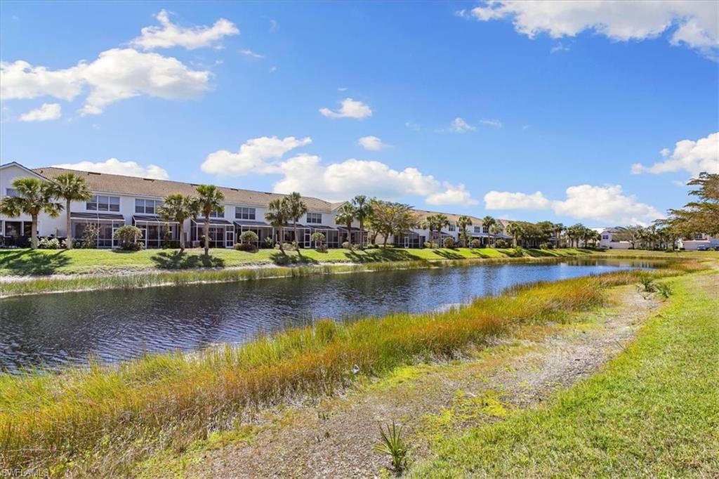 839 Hampton Circle, Unit 149 Naples, FL 34105 - Photo 5 of 22 a view of a lake with houses
