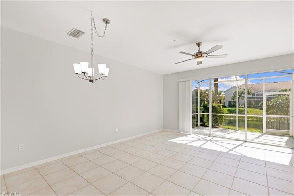 839 Hampton Circle, Unit 149 Naples, FL 34105 - Photo 8 of 22 a view of an empty room with a window