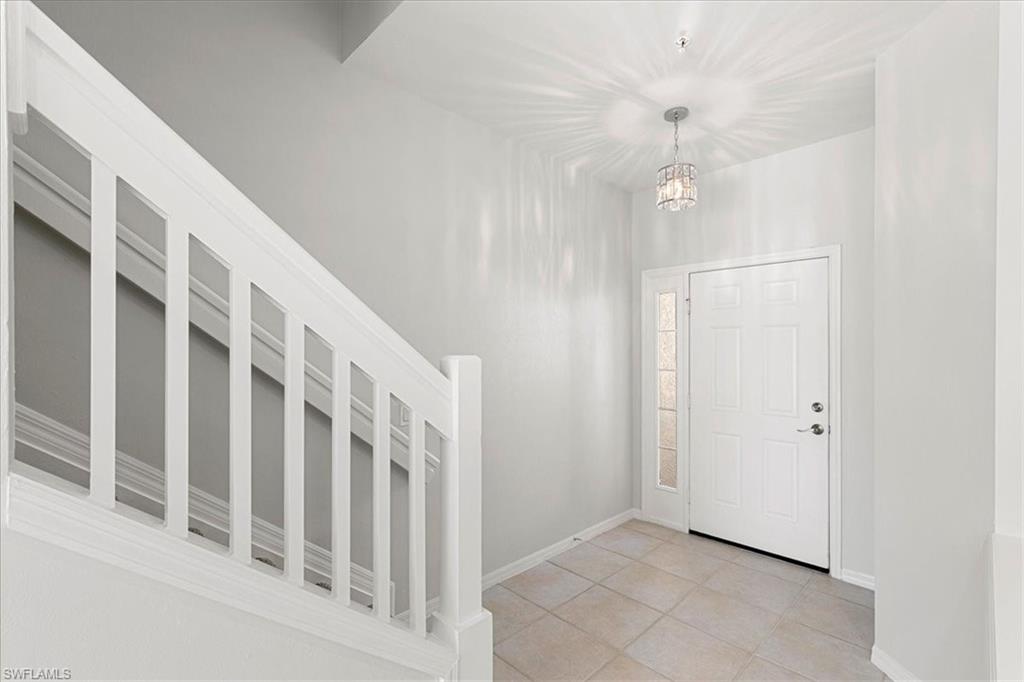 839 Hampton Circle, Unit 149 Naples, FL 34105 - Photo 9 of 22 a view of an entryway with staircase