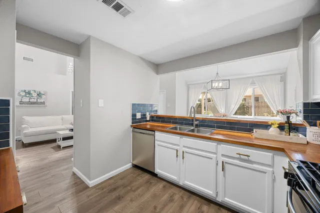 a kitchen with a sink and a window