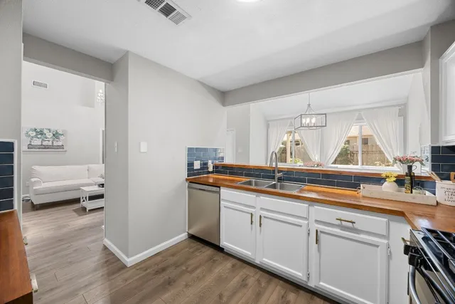 a kitchen with a sink and a window