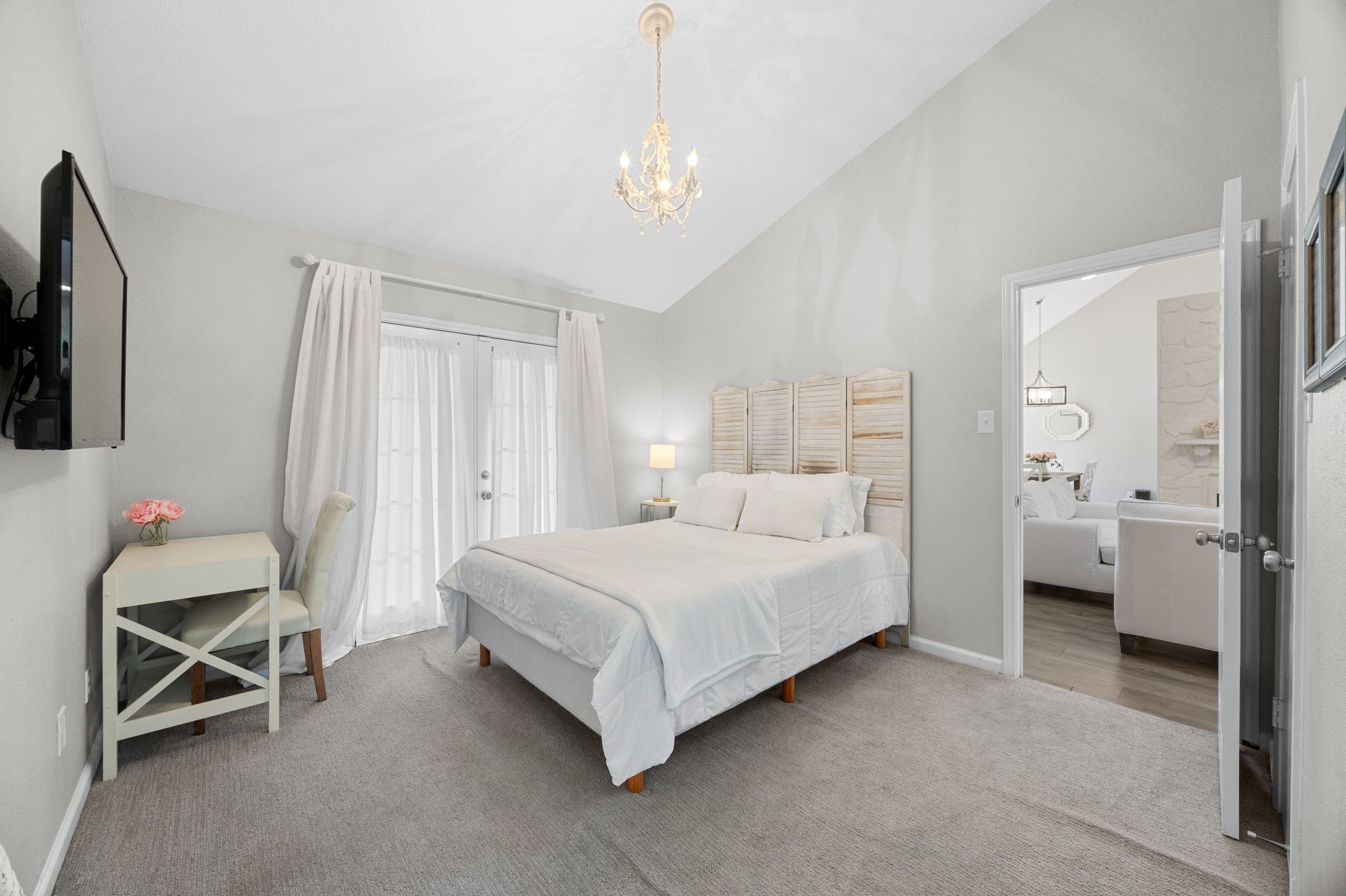 6305 Weeks Cove Austin, TX 78727 - Photo 13 of 30 Bedroom with carpet flooring, a chandelier, and high vaulted ceiling