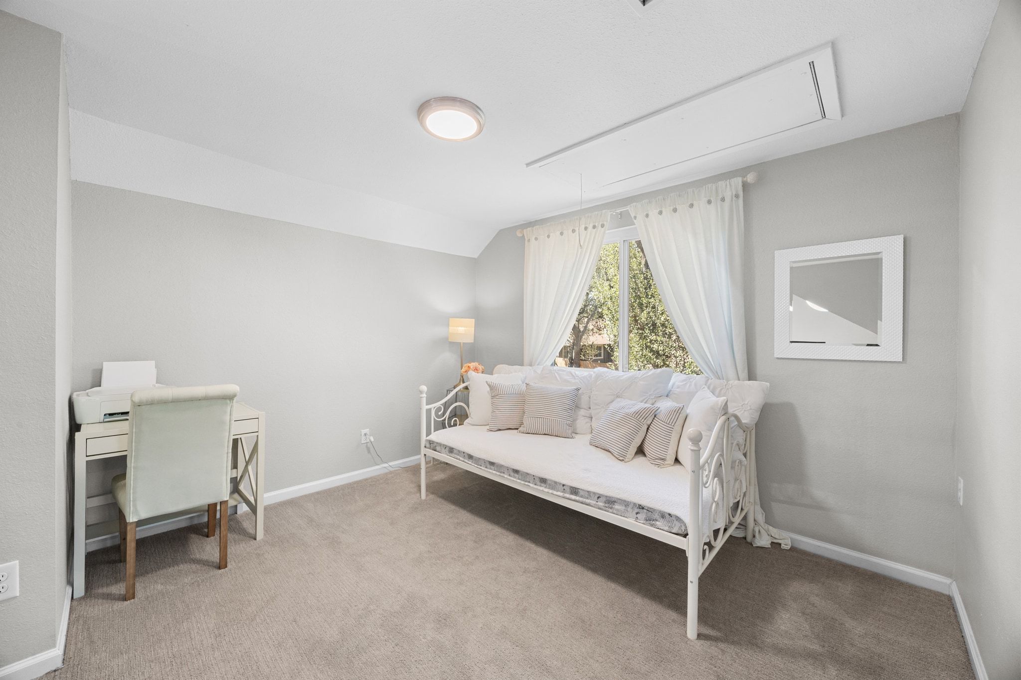 6305 Weeks Cove Austin, TX 78727 - Photo 17 of 30 Bedroom featuring light colored carpet, lofted ceiling, and an office area