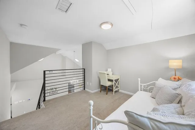 a living room with furniture and a chair