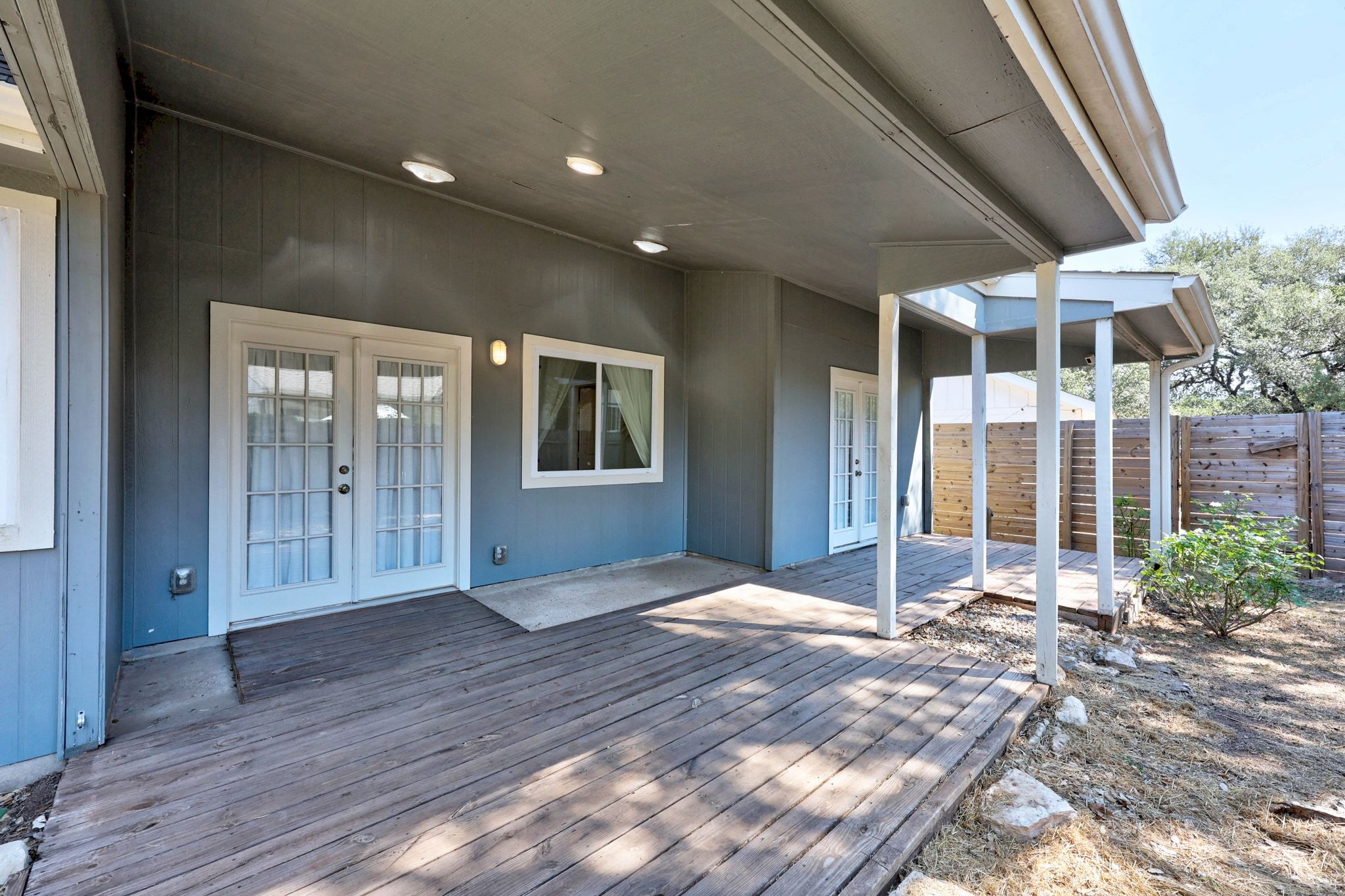 6305 Weeks Cove Austin, TX 78727 - Photo 22 of 30 Wooden deck with french doors and a patio