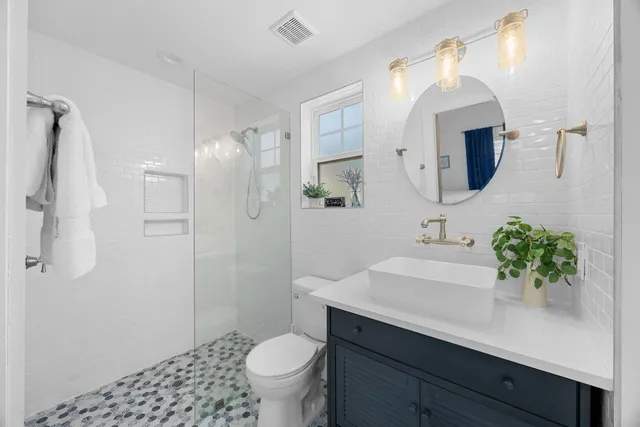 a bathroom with a sink a washer and dryer