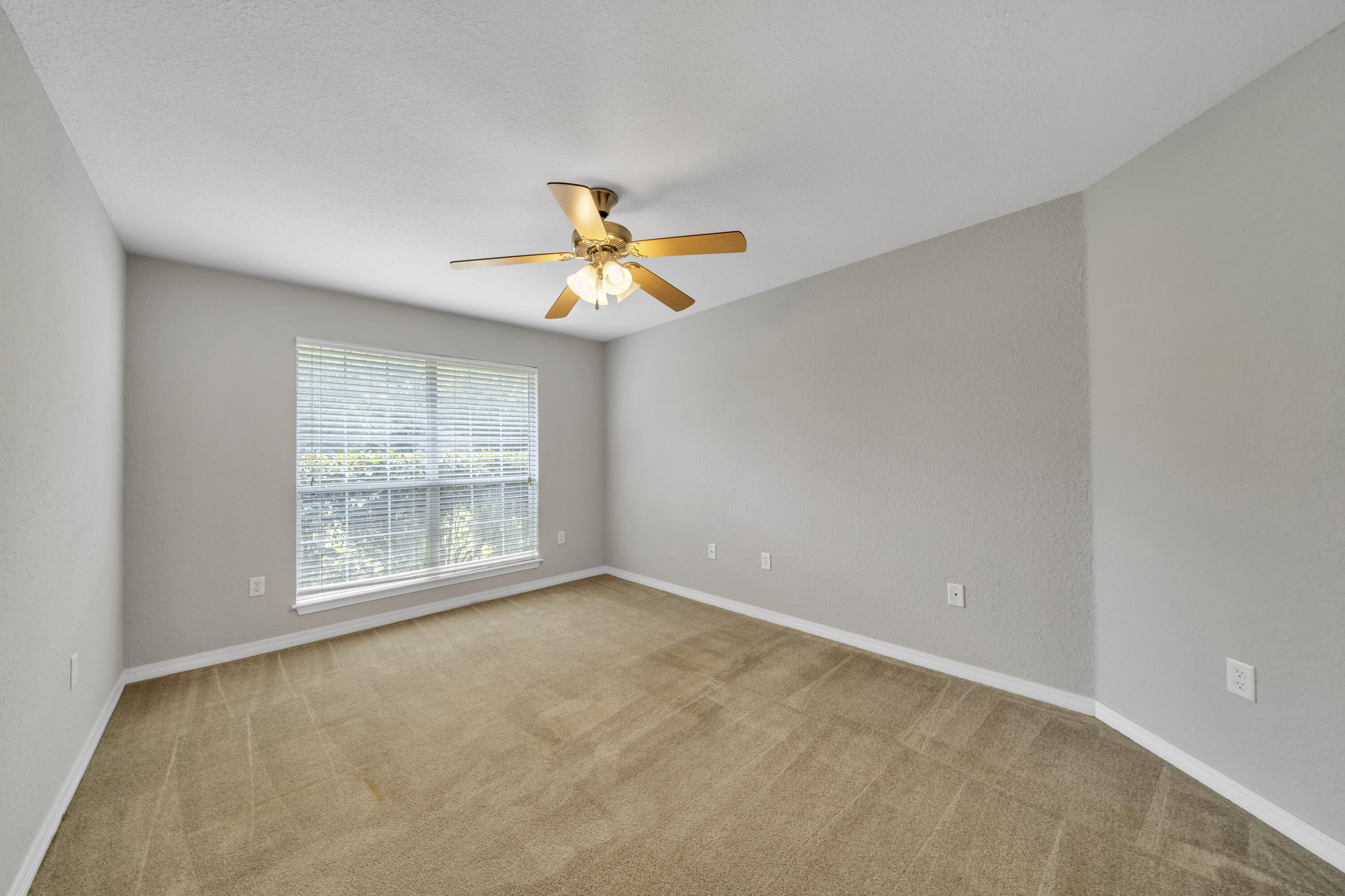 227 East Shipwreck Road Santa Rosa Beach, FL 32459 - Photo 6 of 39 an empty room with a window