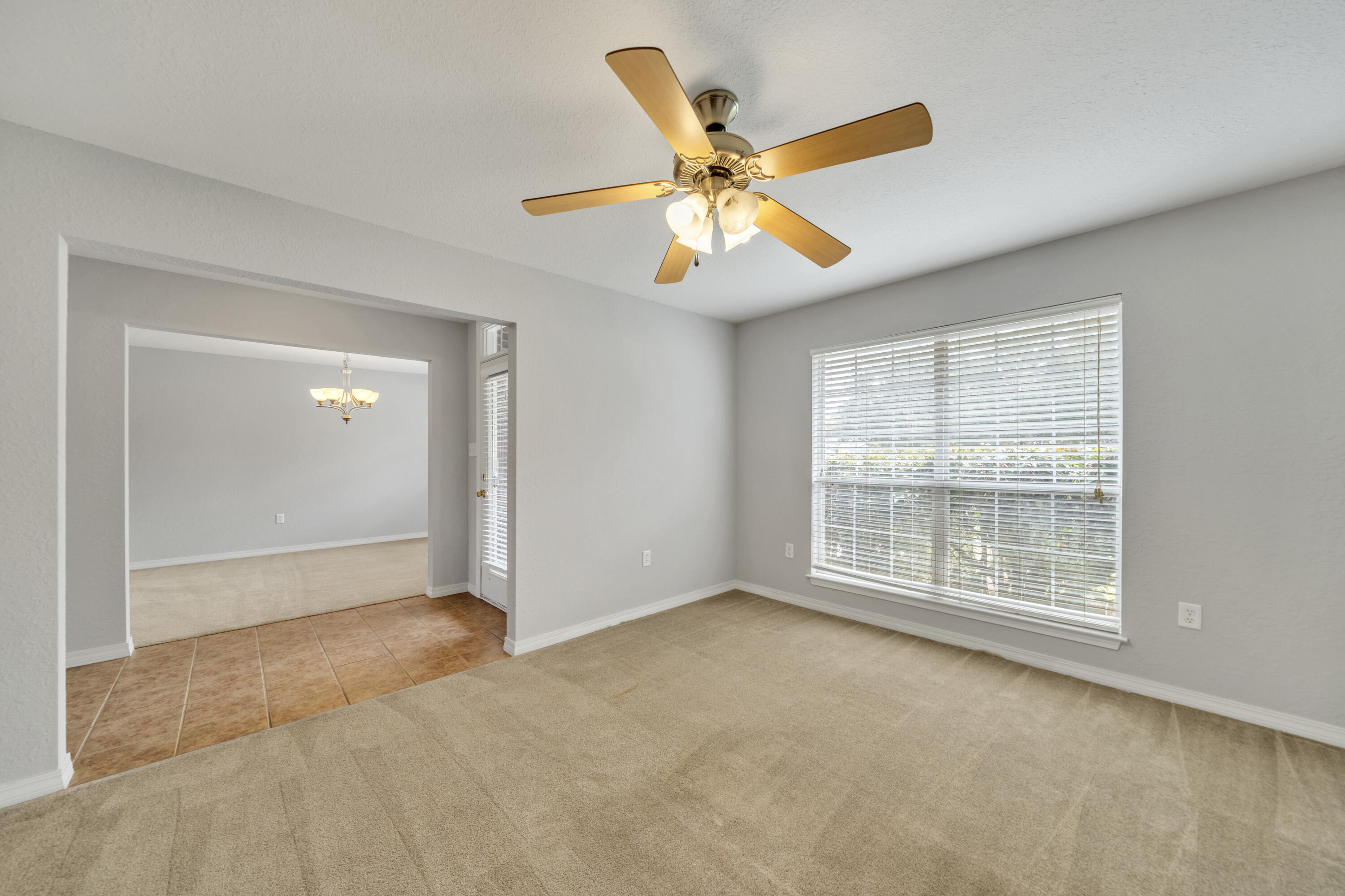 227 East Shipwreck Road Santa Rosa Beach, FL 32459 - Photo 7 of 39 an empty room with window and ceiling fan