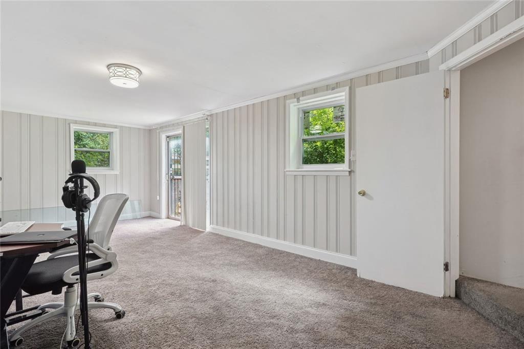 4136 Weelaunee Road Ellenwood, GA 30294 - Photo 11 of 22 a view of a workspace with furniture and a window