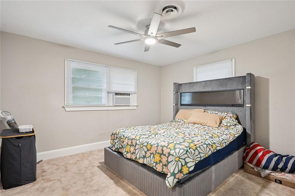 4136 Weelaunee Road Ellenwood, GA 30294 - Photo 17 of 22 a bedroom with a bed and window