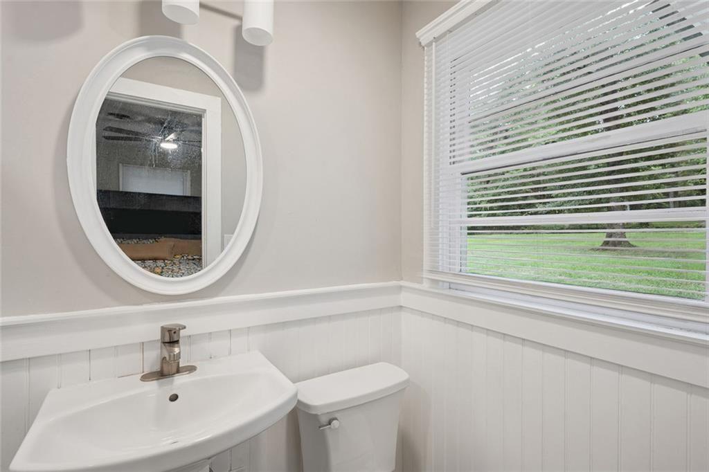 4136 Weelaunee Road Ellenwood, GA 30294 - Photo 18 of 22 a bathroom with a sink and a mirror